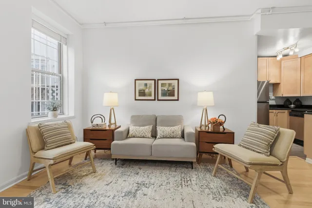 a living room with furniture and a large window