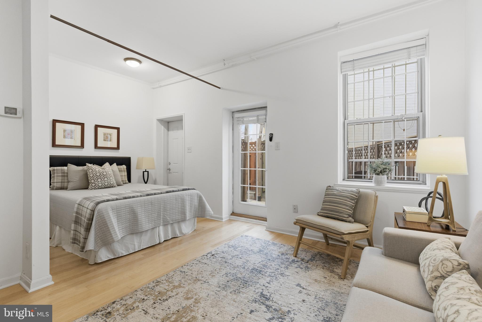 101 North Carolina Avenue Southeast, Unit G Washington, DC 20003 - Photo 9 of 17 a spacious bedroom with a bed and couch