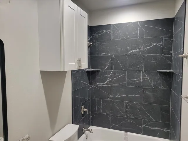 a bathroom with a sink and toilet