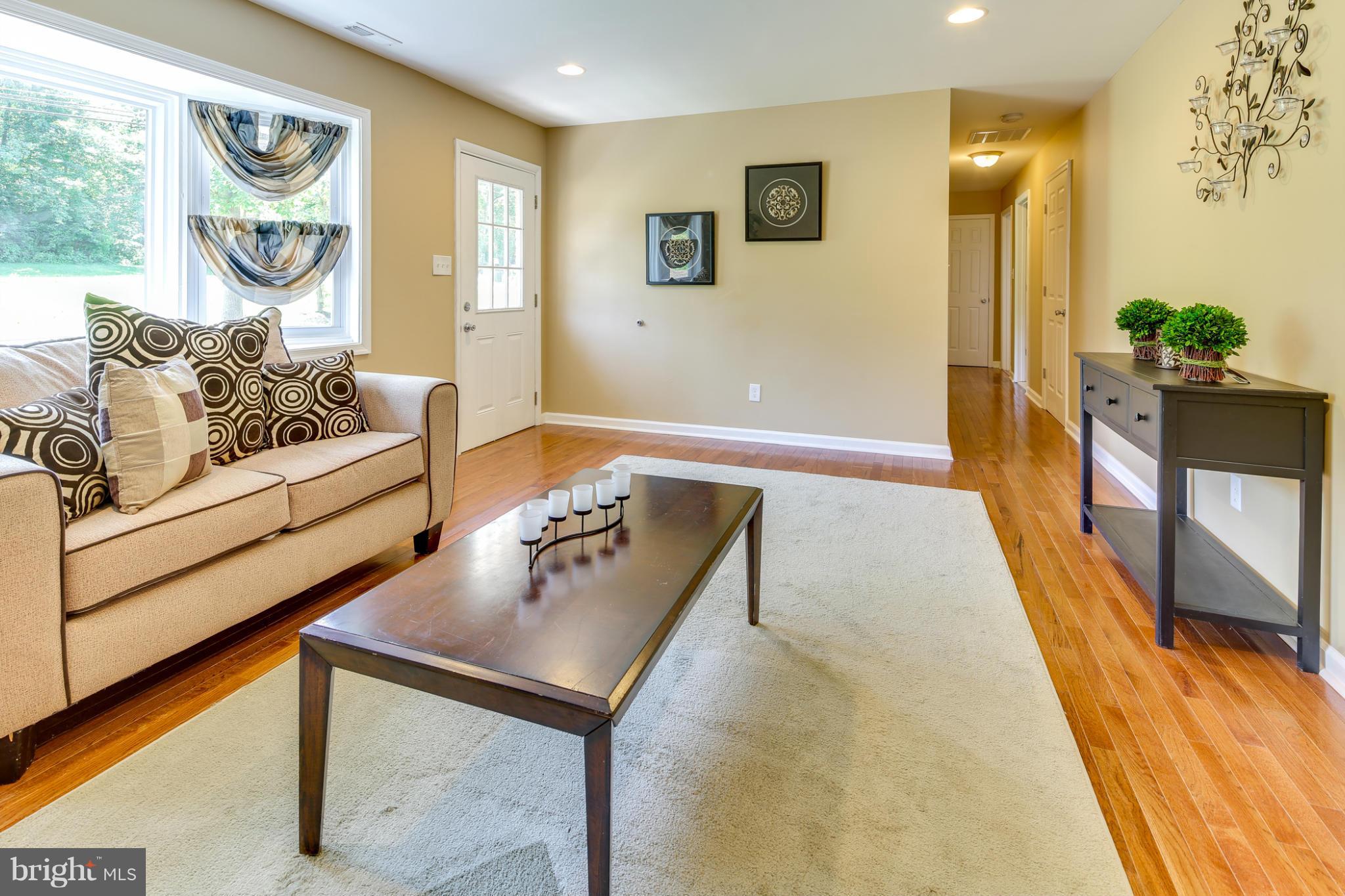 3036 Warehime Road Manchester, MD 21102 - Photo 5 of 30 a living room with furniture and a gate