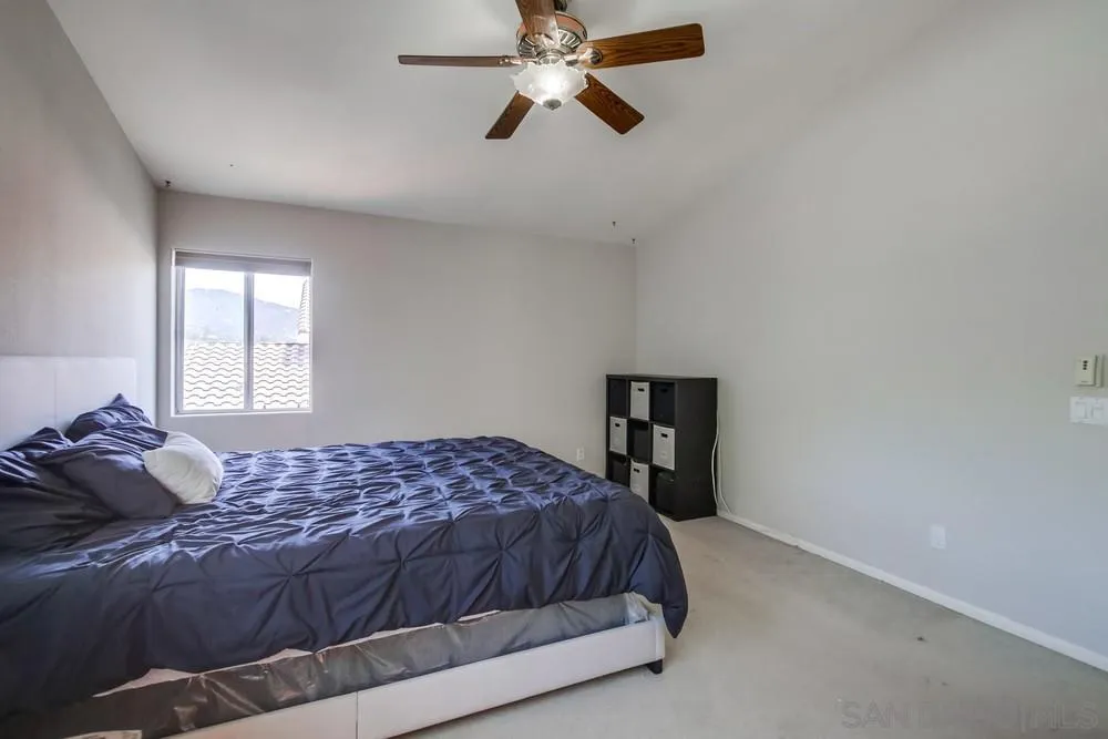 9185 Lake Valley Road El Cajon, CA 92021 - Photo 23 of 43 a bedroom with a bed and a window