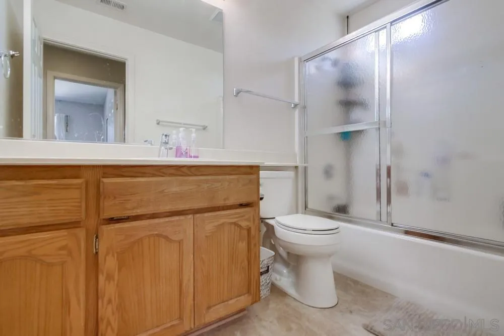 9185 Lake Valley Road El Cajon, CA 92021 - Photo 28 of 43 a bathroom with a toilet sink and shower