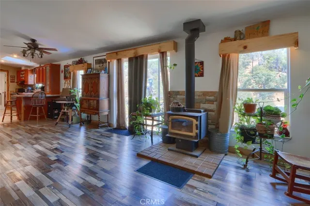 a living room with furniture fireplace and flat screen tv