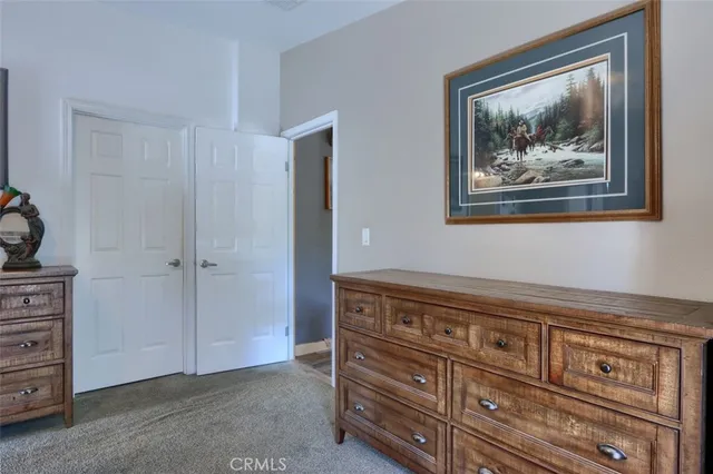 a bathroom with a tub double sink window and mirror