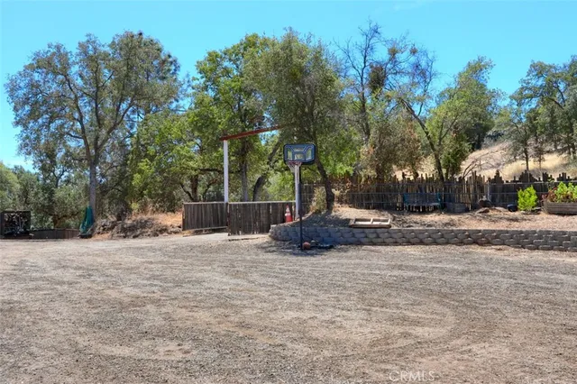 an aerial view of a house with outdoor space