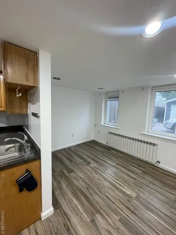 a kitchen with a stove a refrigerator and cabinets