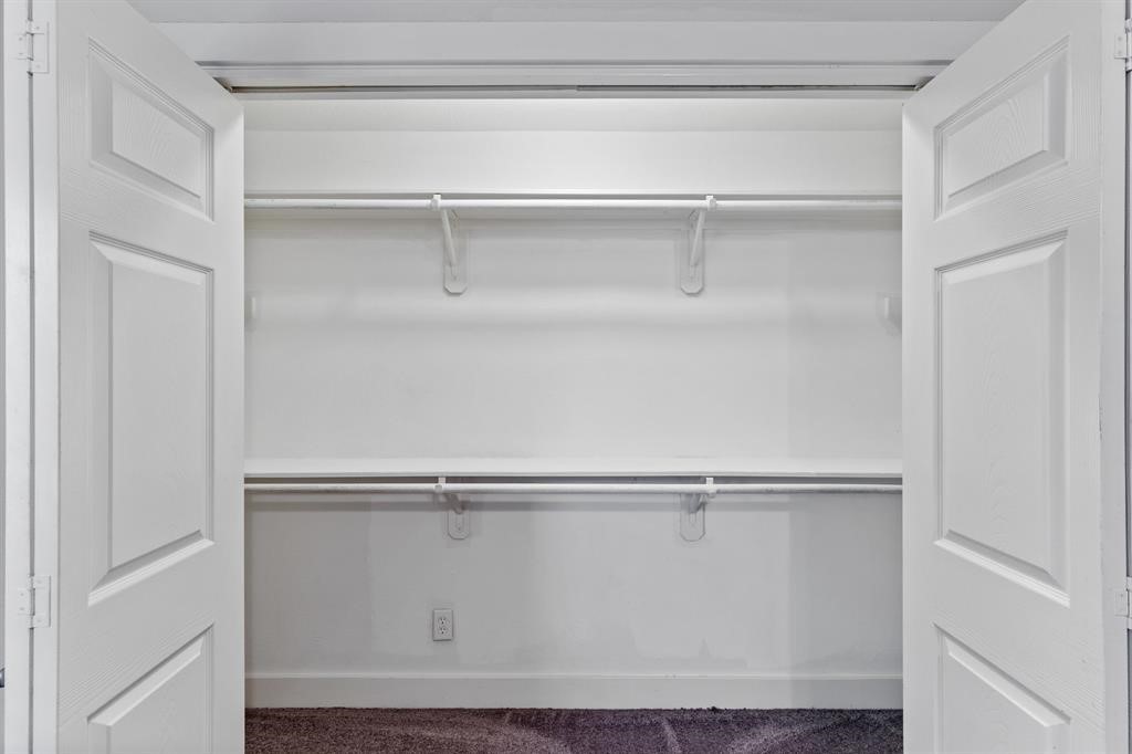1305 Idylwild Street Houston, TX 77009 - Photo 26 of 31 Spacious and clean double-door closet with ample shelving and hanging space, perfect for organizing clothing and accessories.