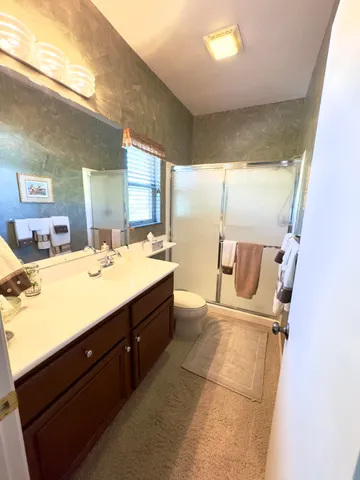 a bathroom with a sink mirror and a bathtub