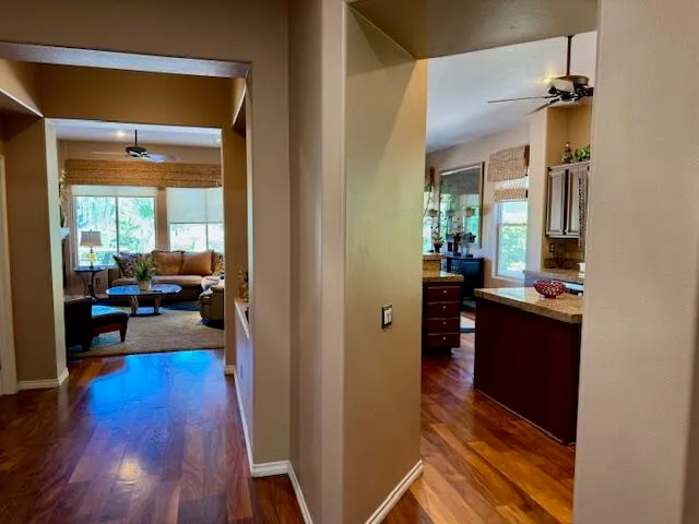 a living room with furniture and a mirror