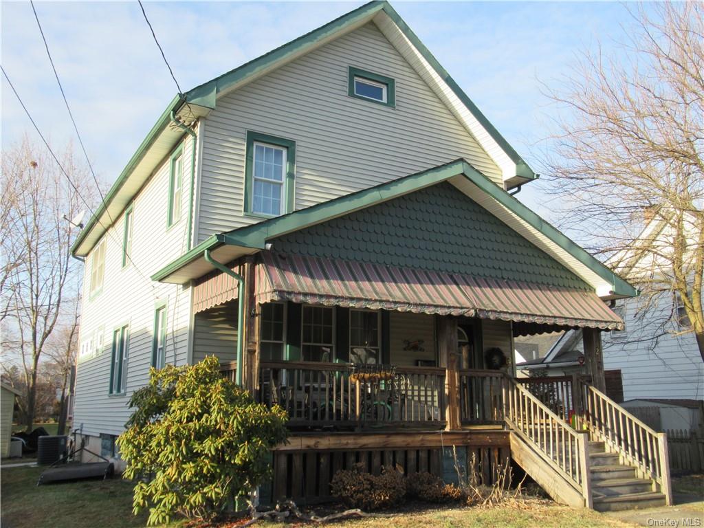 32 Holbrook Street Port Jervis, NY 12771 - Photo 1 of 36 a front view of house along with deck and outdoor seating