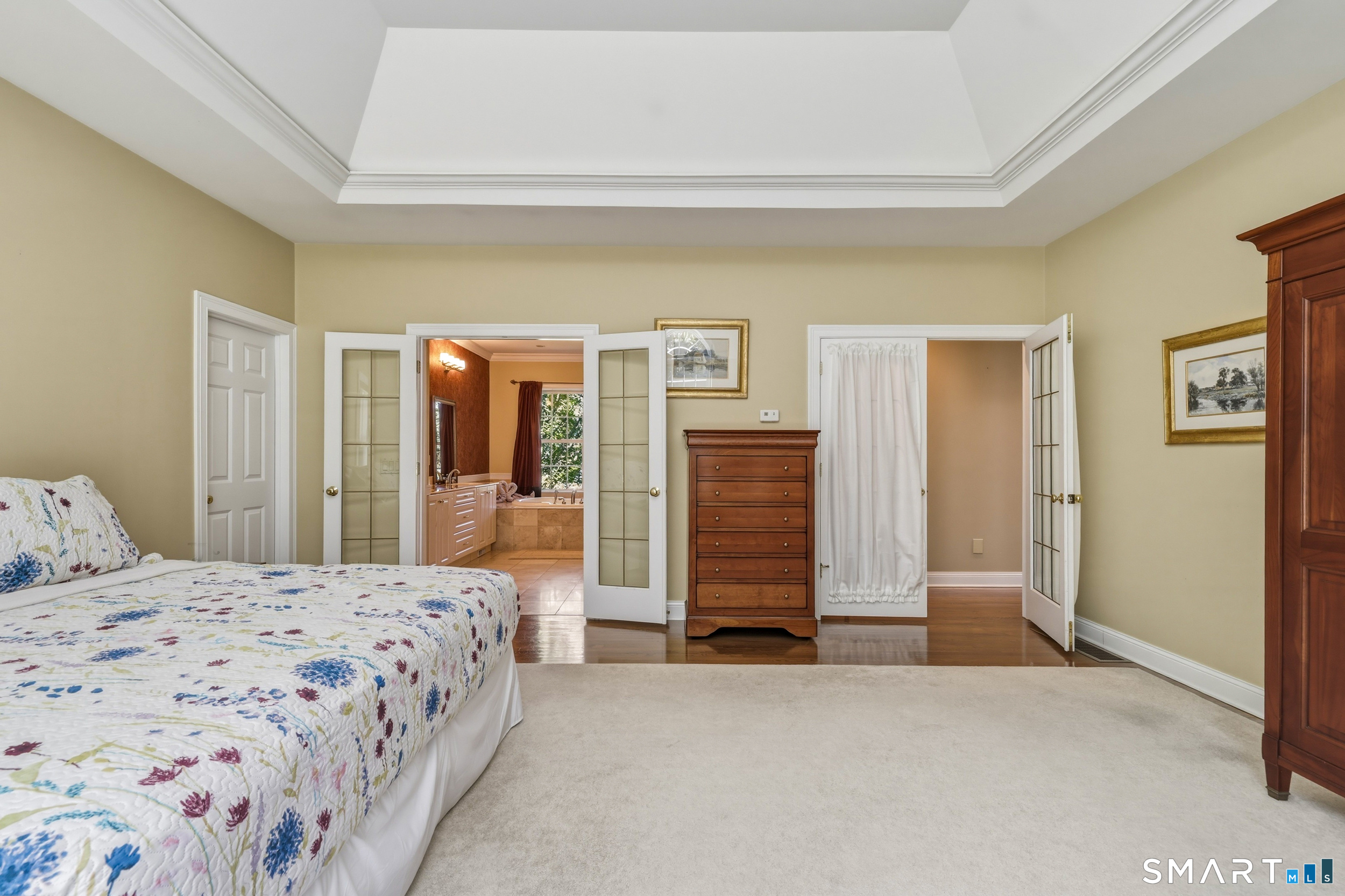 122 Lower Road Guilford, CT 06437 - Photo 15 of 40 The master bedroom suite also offers hardwood floor, a full bath and two walk-in closets.