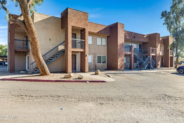 a view of a house with snow on the road