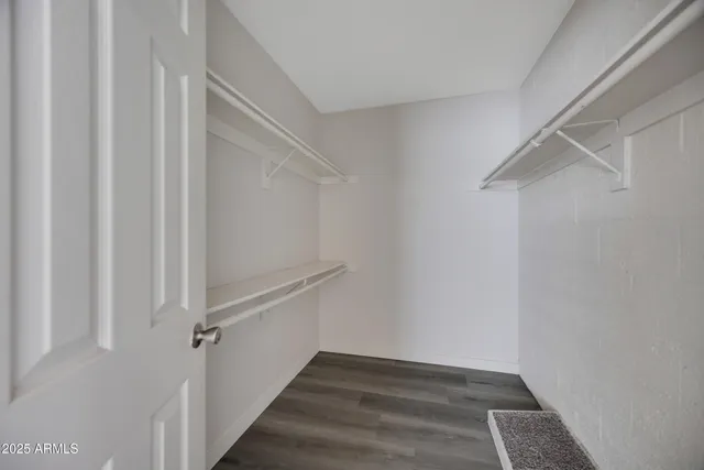 a view of an empty walk in closet