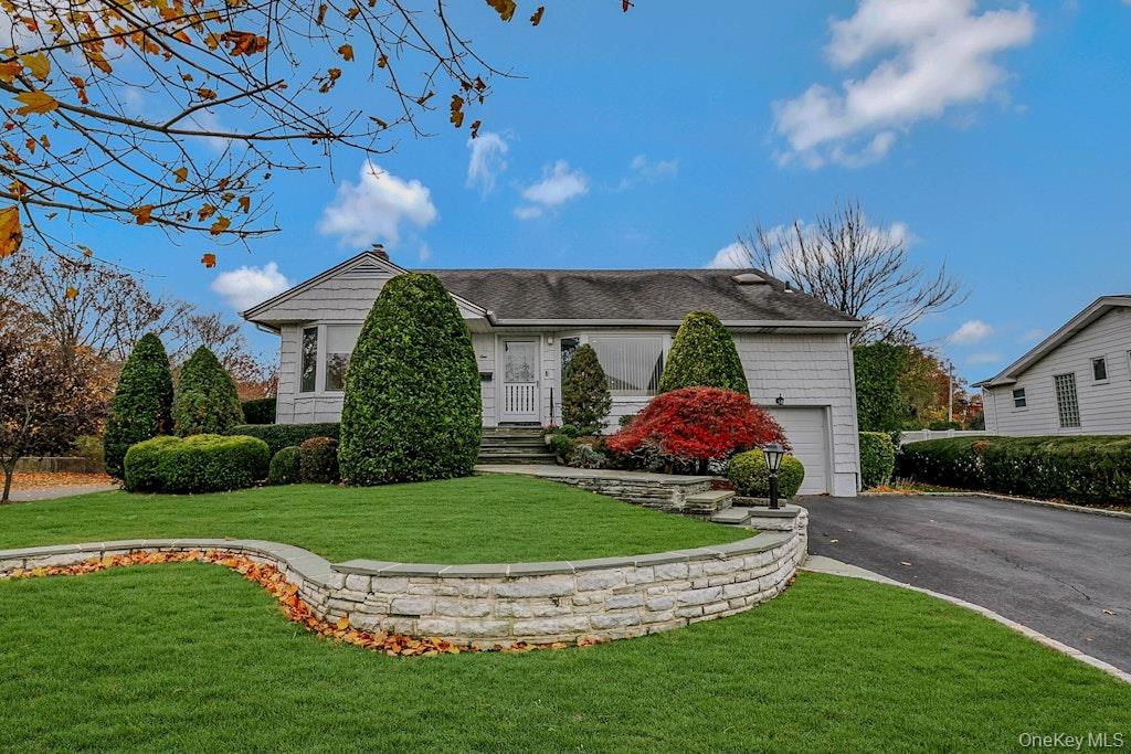 1 Fulton Place Jericho, NY 11753 - Photo 1 of 1 a front view of a house with a yard