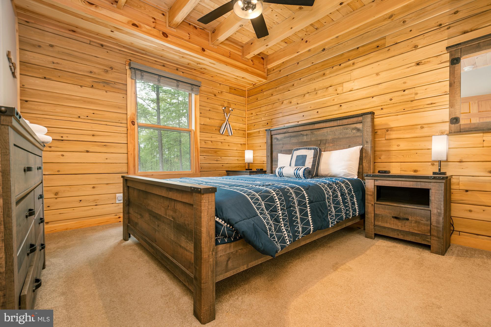 966 Fork Run Trail McHenry, MD 21541 - Photo 28 of 50 a bedroom with a bed and a dresser