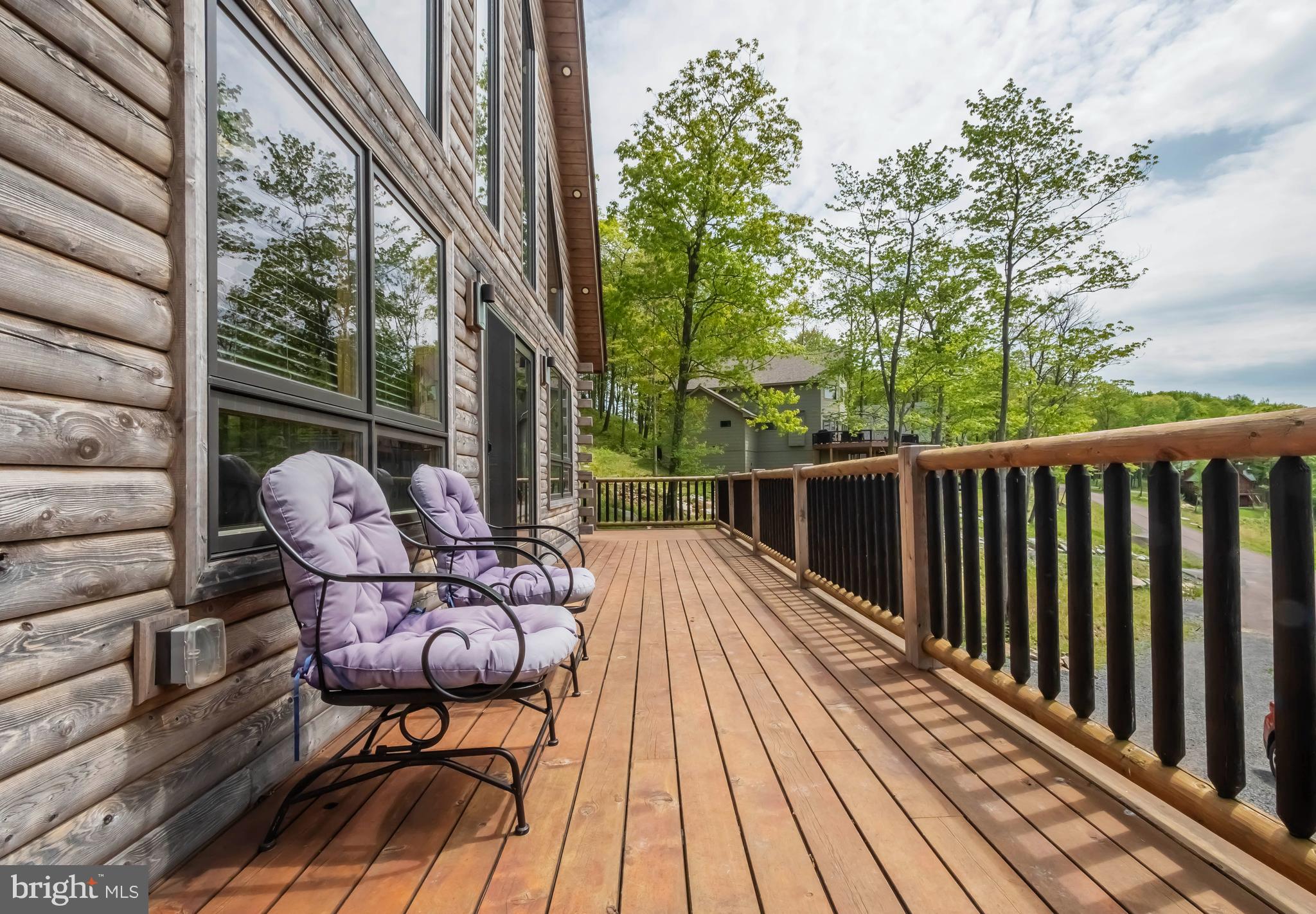 966 Fork Run Trail McHenry, MD 21541 - Photo 5 of 50 a balcony with wooden floor and furniture
