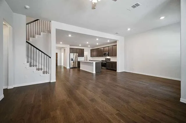 a view of kitchen with cabinets and wooden floor