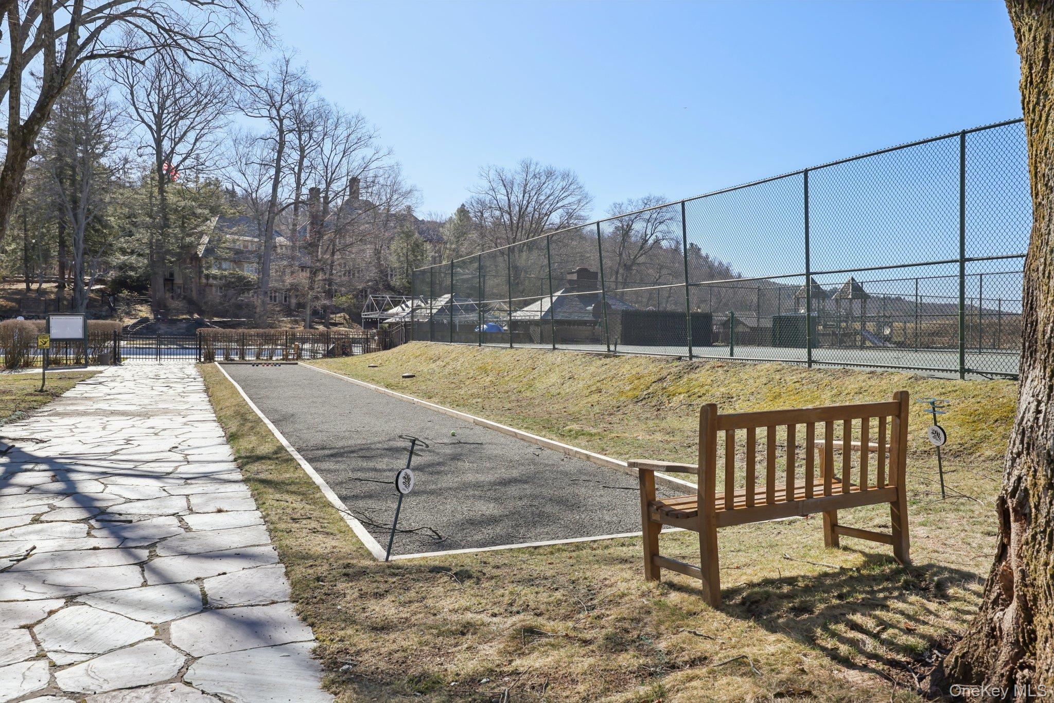 Serpentine Road Tuxedo Park, NY 10987 - Photo 12 of 12 a view of a swimming pool with a patio