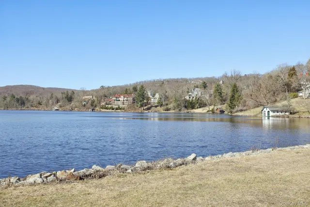 a view of a white house with large windows