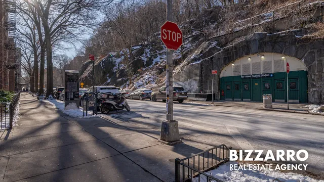 a view of a building with a snow on the road