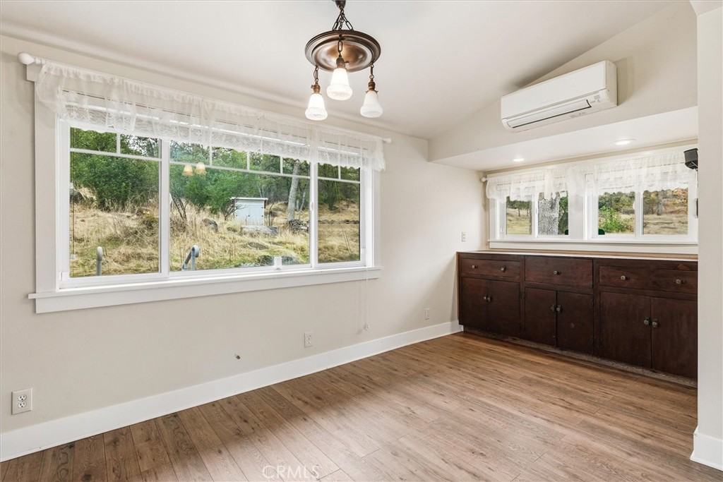 4489 Varain Road Mariposa, CA 95338 - Photo 24 of 39 a view of empty room with a window and wooden floor