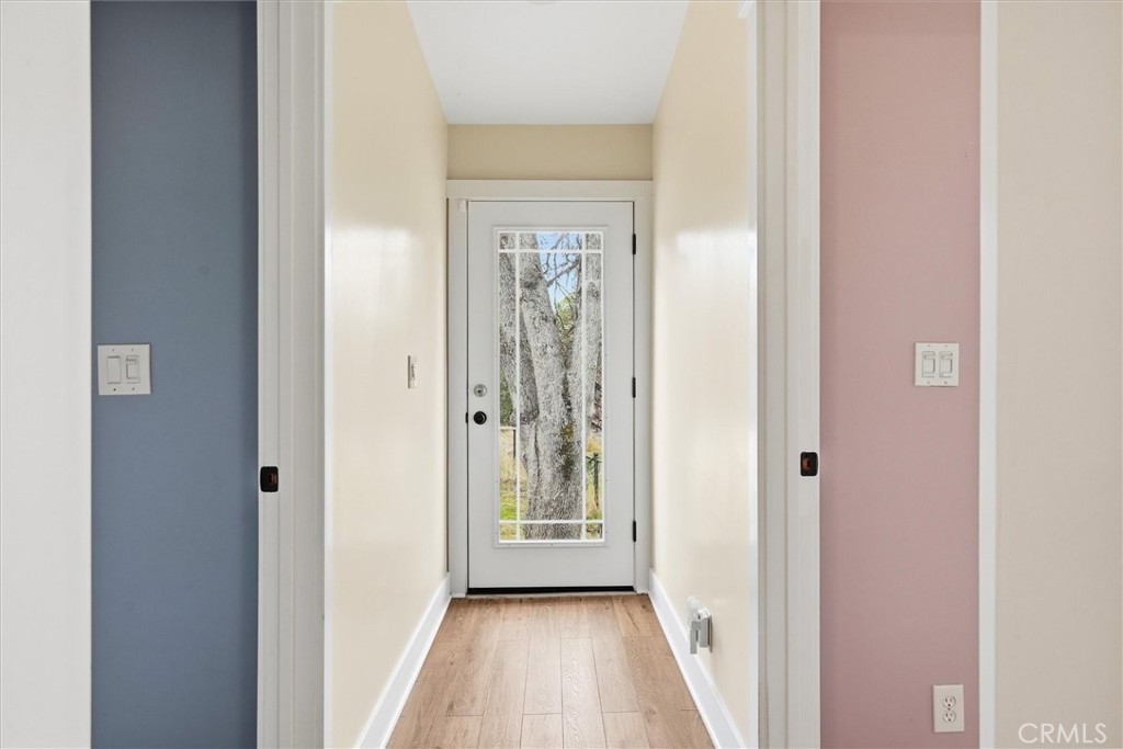 4489 Varain Road Mariposa, CA 95338 - Photo 4 of 39 a view of a hallway with wooden floor and closet