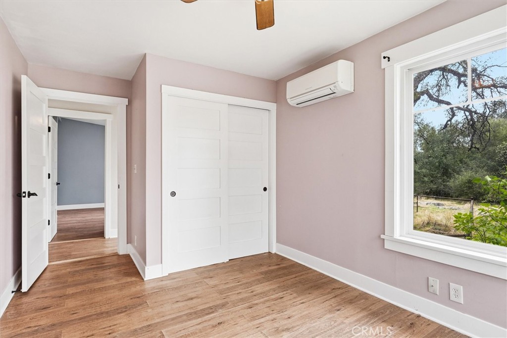 4489 Varain Road Mariposa, CA 95338 - Photo 7 of 39 a view of hallway with a large window and wooden floor
