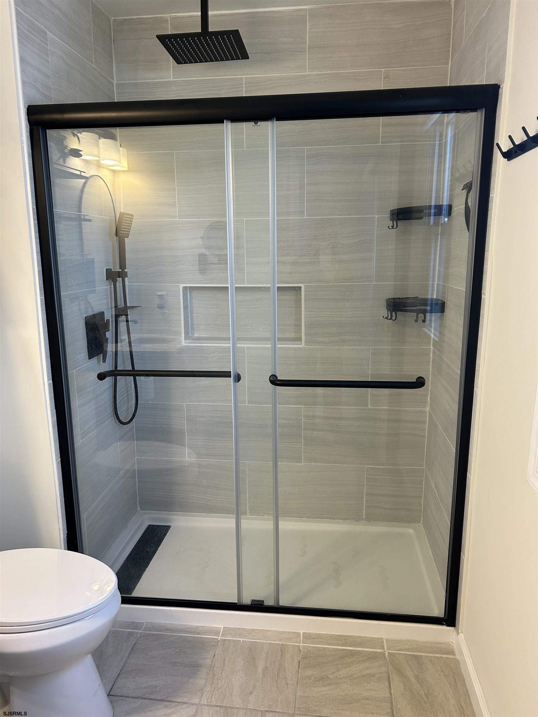 12 Vardon Road Brigantine, NJ 08203 - Photo 16 of 28 a bathroom with a shower and toilet