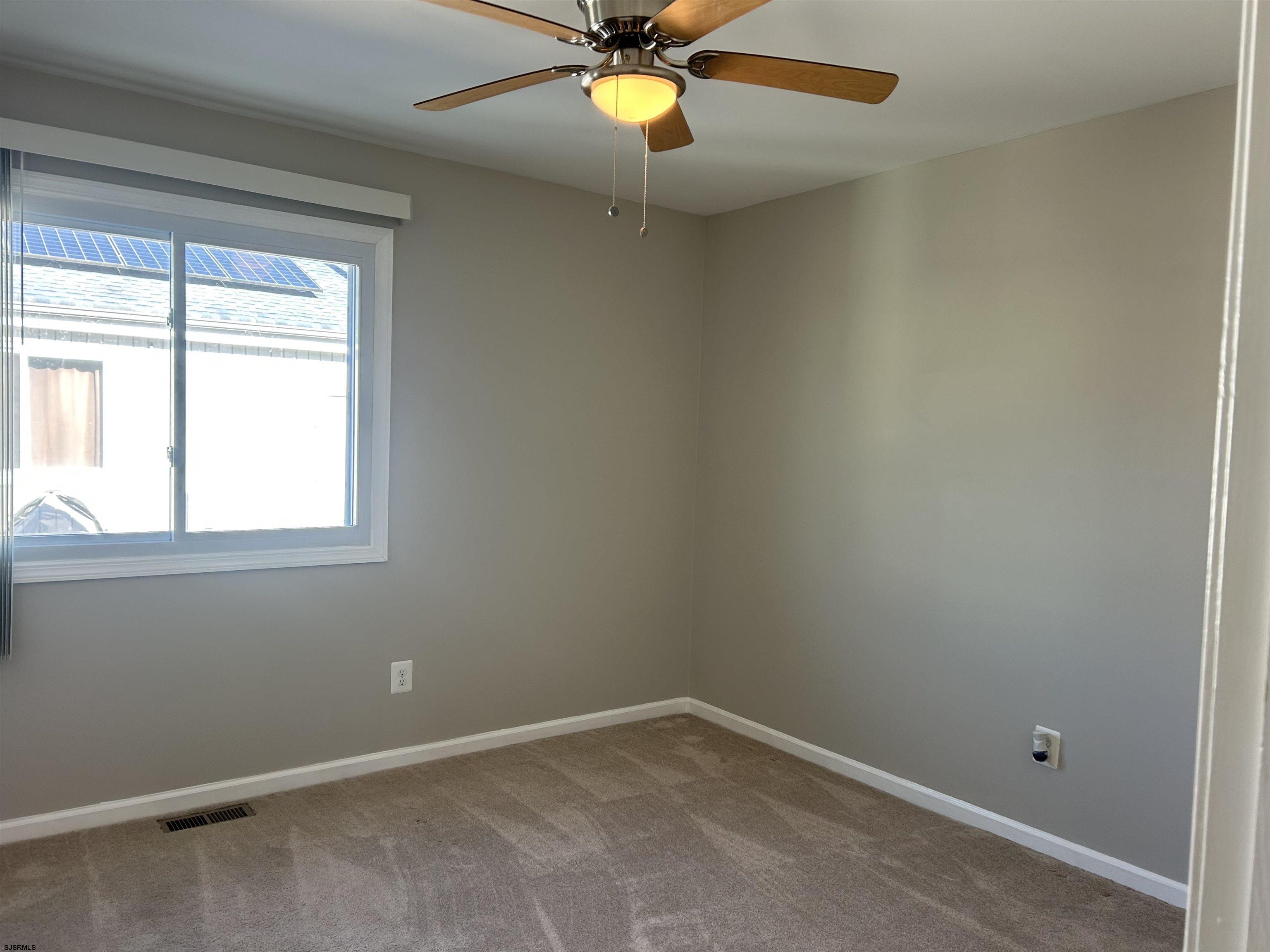 12 Vardon Road Brigantine, NJ 08203 - Photo 19 of 28 an empty room with windows and fan