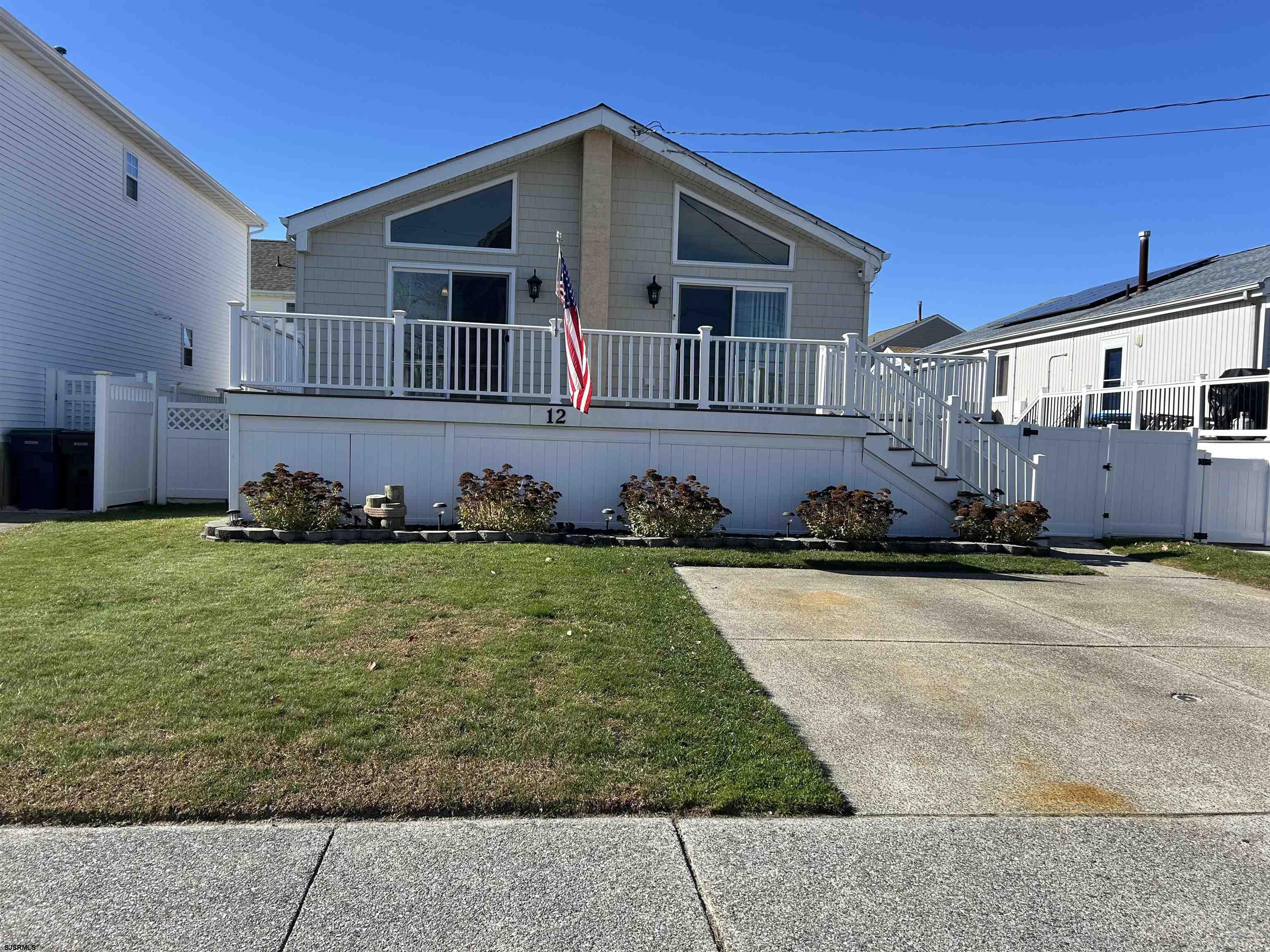 12 Vardon Road Brigantine, NJ 08203 - Photo 2 of 28 a front view of a house with a yard