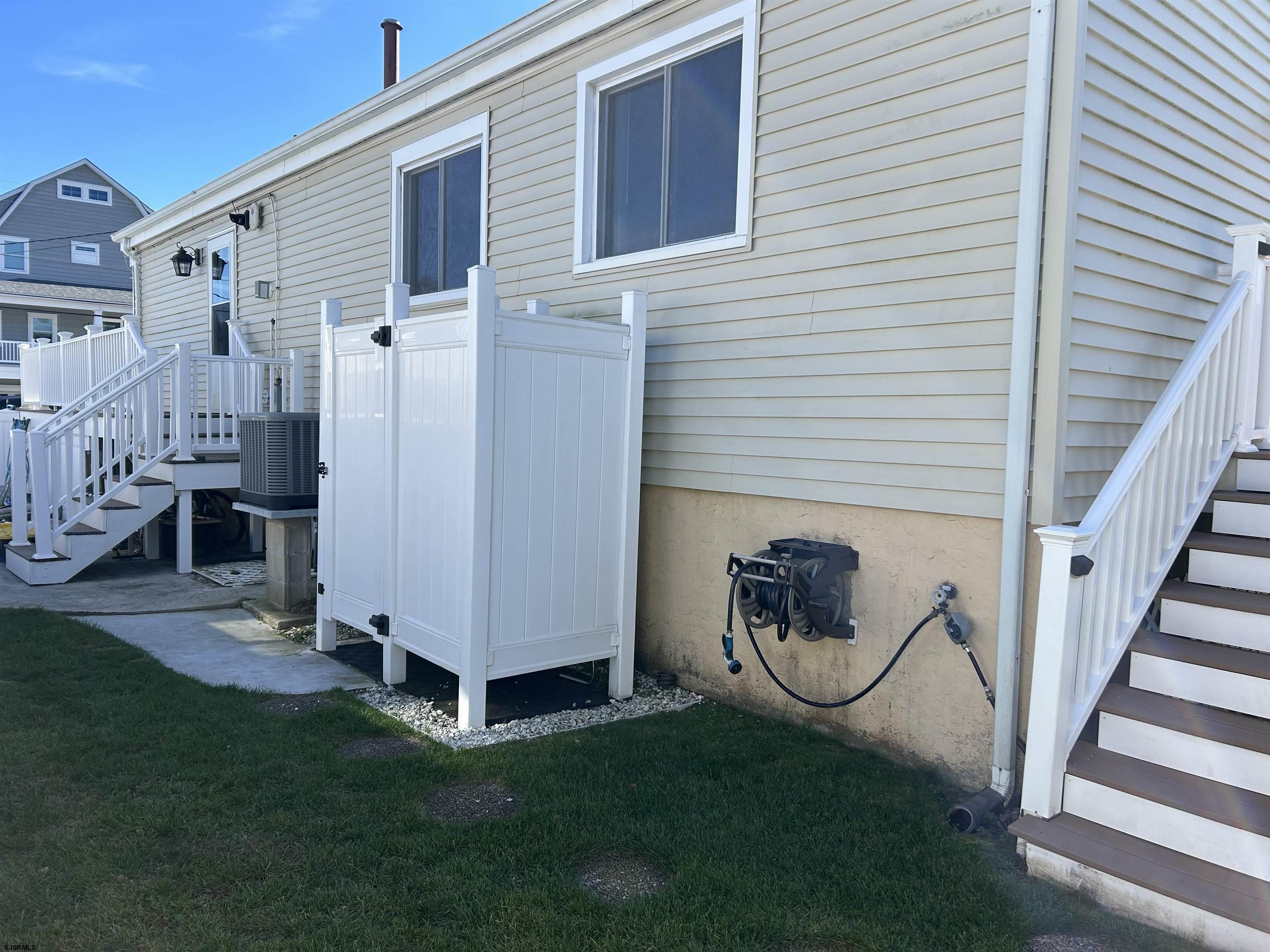 12 Vardon Road Brigantine, NJ 08203 - Photo 23 of 28 a backyard of a house with table and chairs
