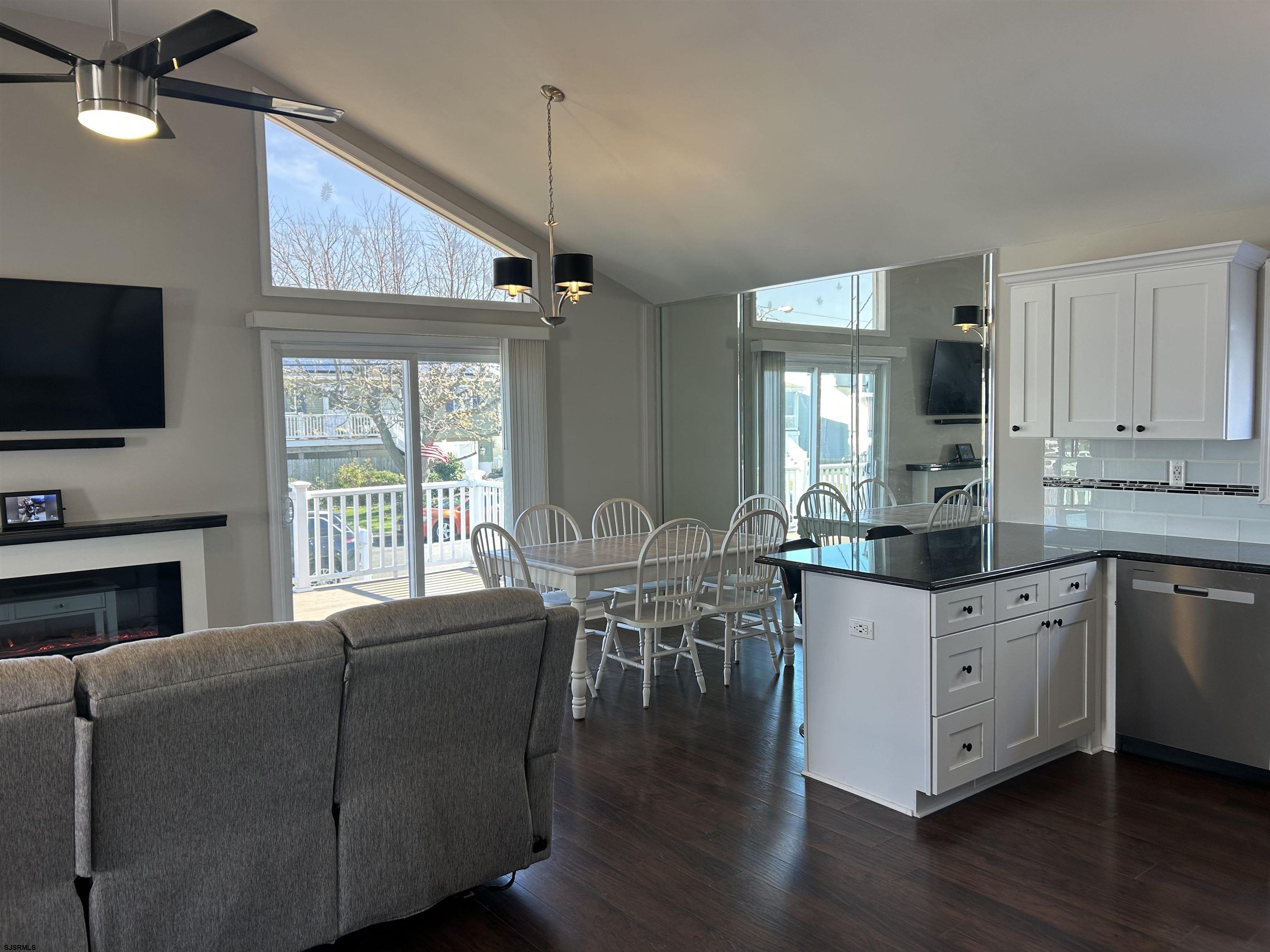 12 Vardon Road Brigantine, NJ 08203 - Photo 3 of 28 a living room with furniture a flat screen tv and kitchen view