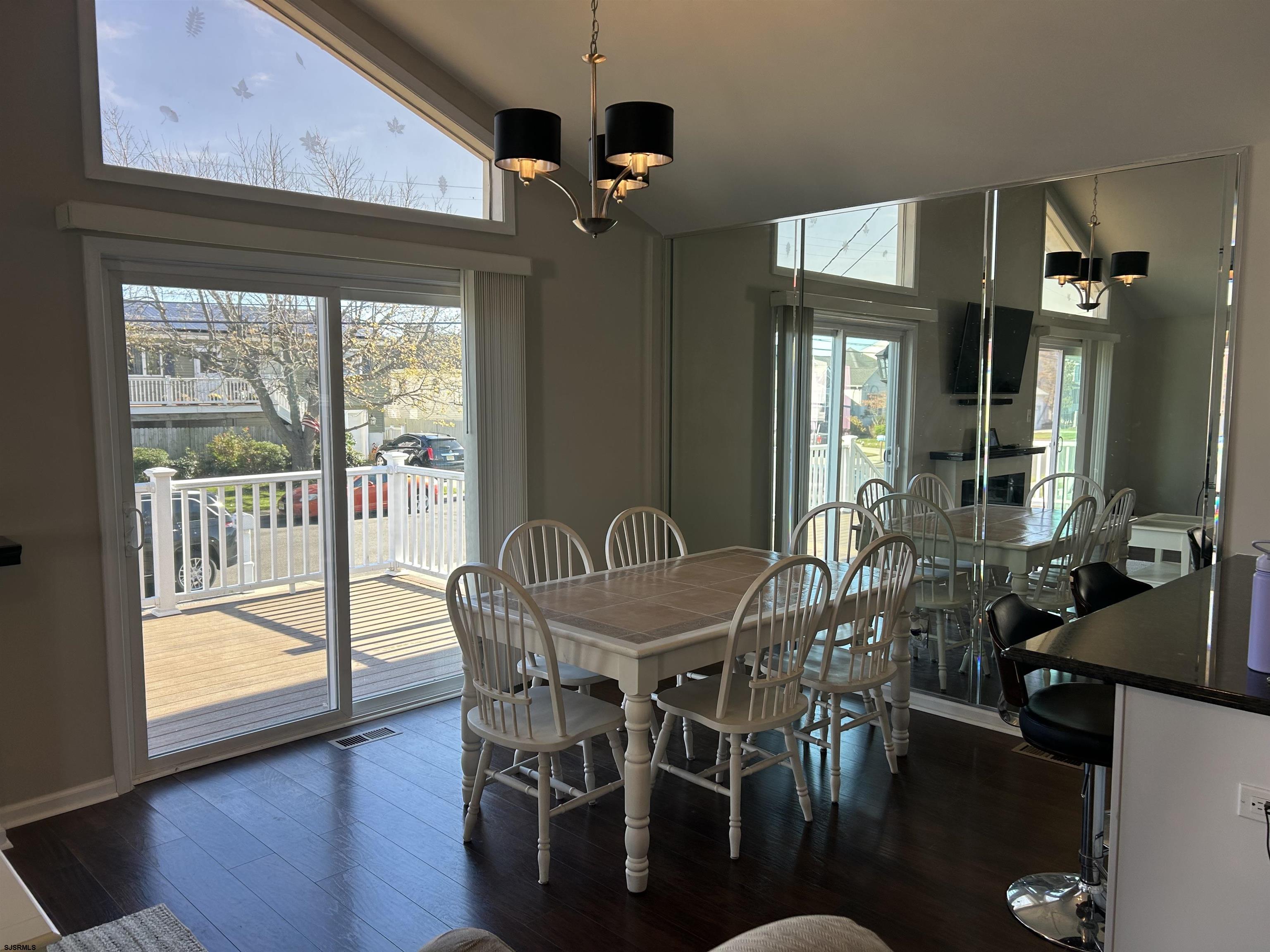 12 Vardon Road Brigantine, NJ 08203 - Photo 6 of 28 a view of a dining room with furniture window and wooden floor