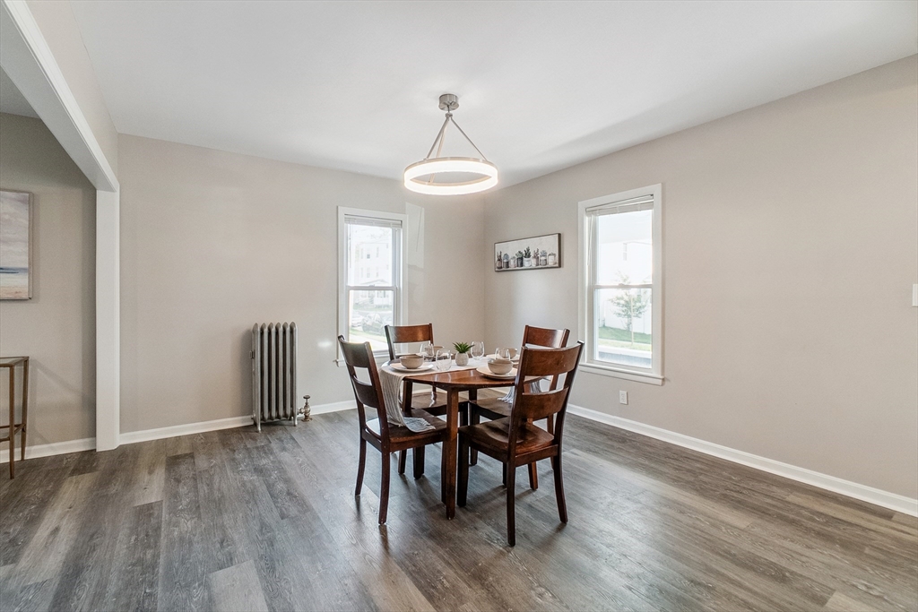 26 Olivine Street Chicopee, MA 01013 - Photo 11 of 26 a view of a dining room with furniture window and wooden floor