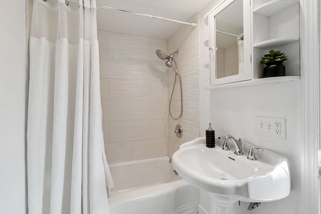 26 Olivine Street Chicopee, MA 01013 - Photo 20 of 26 a white bath tub sitting next to a white sink