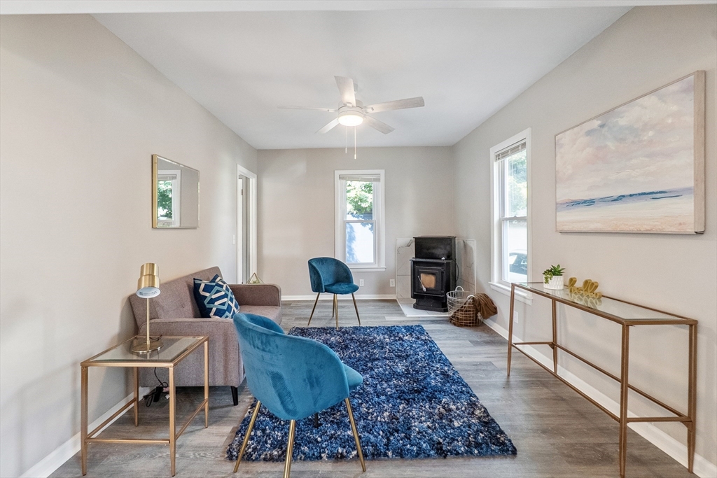 26 Olivine Street Chicopee, MA 01013 - Photo 4 of 26 a living room with furniture a large window and a fireplace