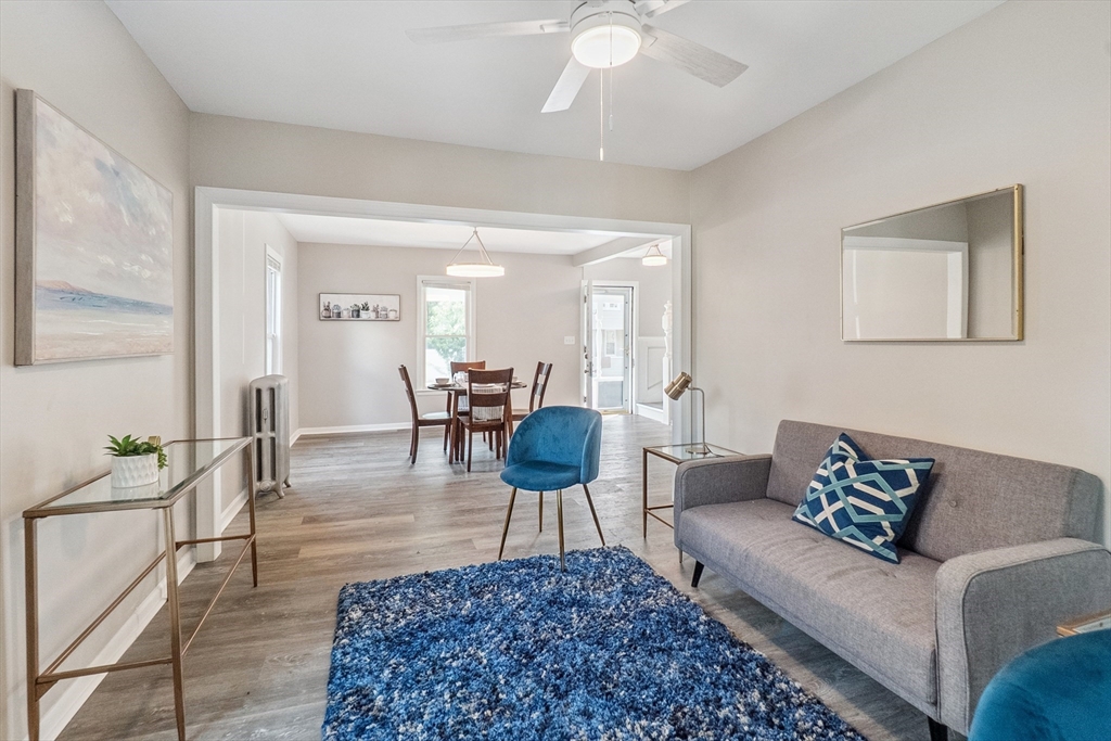 26 Olivine Street Chicopee, MA 01013 - Photo 5 of 26 a living room with furniture and a chandelier