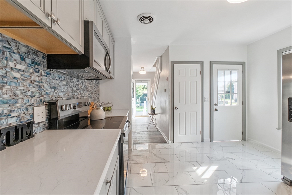 26 Olivine Street Chicopee, MA 01013 - Photo 8 of 26 a view of a kitchen with furniture and a kitchen