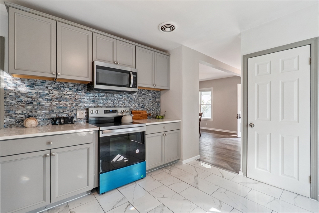 26 Olivine Street Chicopee, MA 01013 - Photo 9 of 26 a kitchen with a sink and cabinets