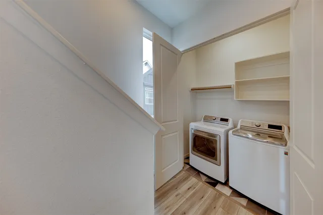a kitchen with a stove top oven and cabinets