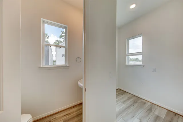 a view of room with window and hallway