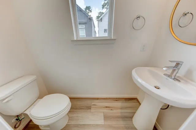 a bathroom with a toilet and a sink
