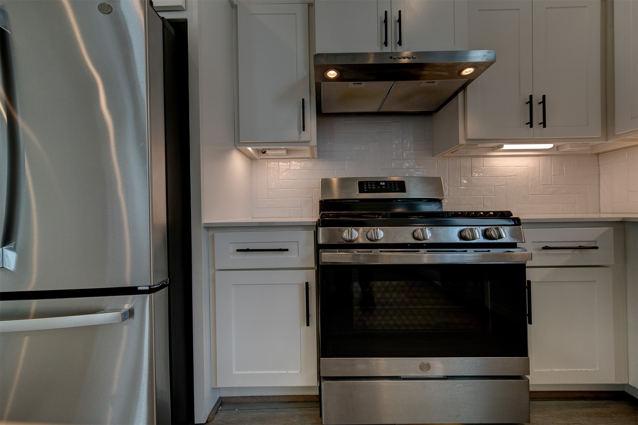 1526 Ojeman Road, Unit A Houston, TX 77055 - Photo 25 of 34 a stove top oven sitting inside of a kitchen