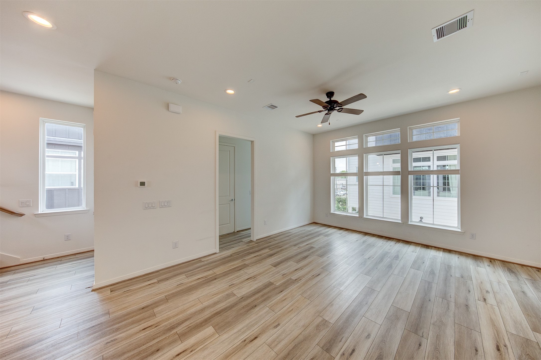 1526 Ojeman Road, Unit A Houston, TX 77055 - Photo 34 of 34 a view of an empty room with a window and wooden floor