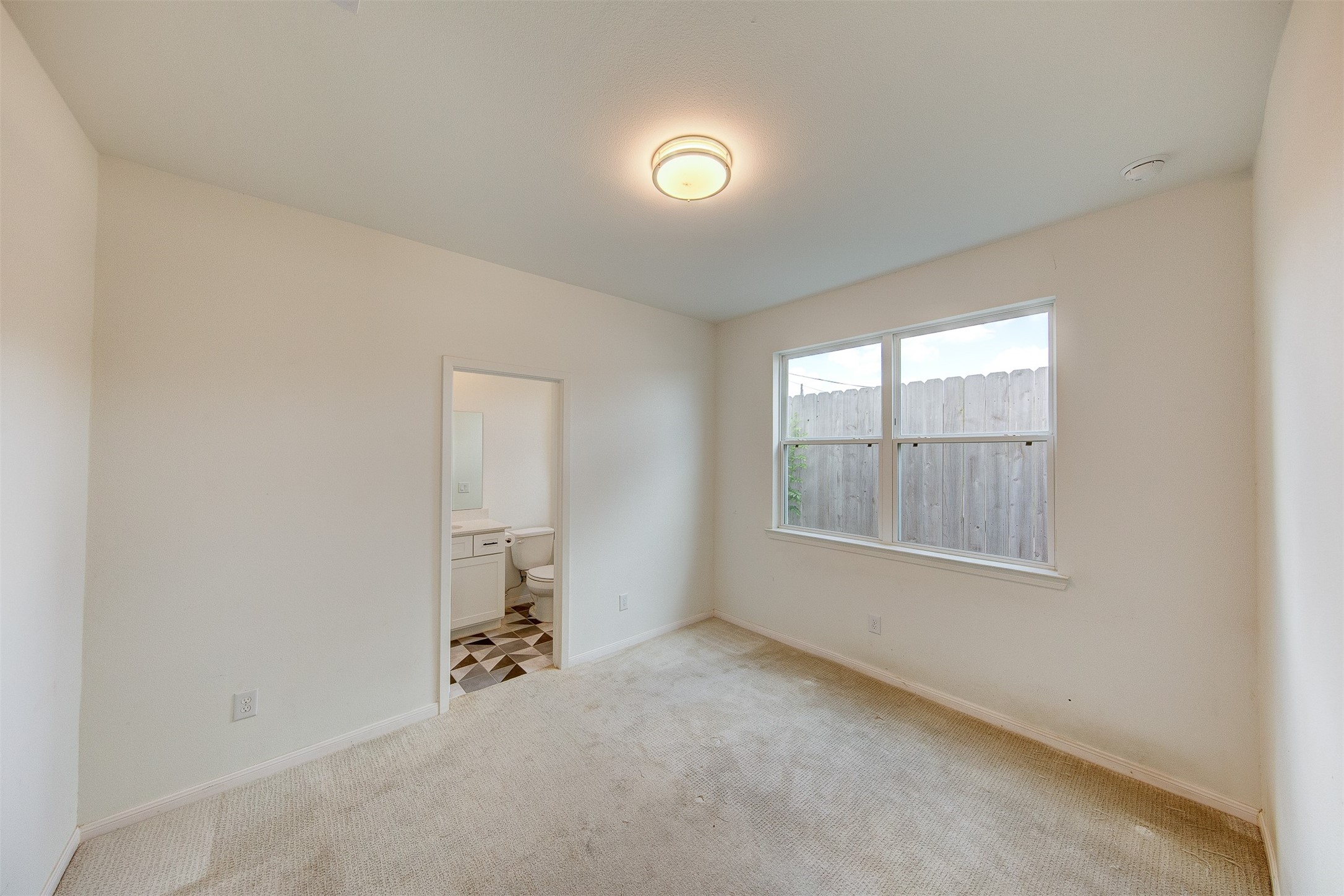 1526 Ojeman Road, Unit A Houston, TX 77055 - Photo 9 of 34 an empty room with a window