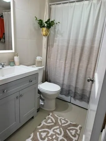 a bathroom with a toilet and a sink