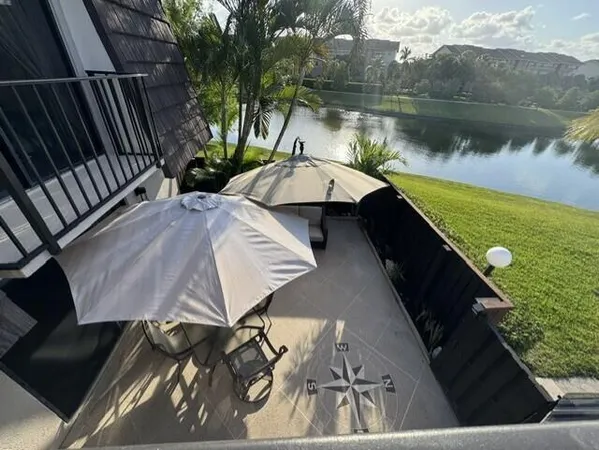 a view of a backyard with sitting area