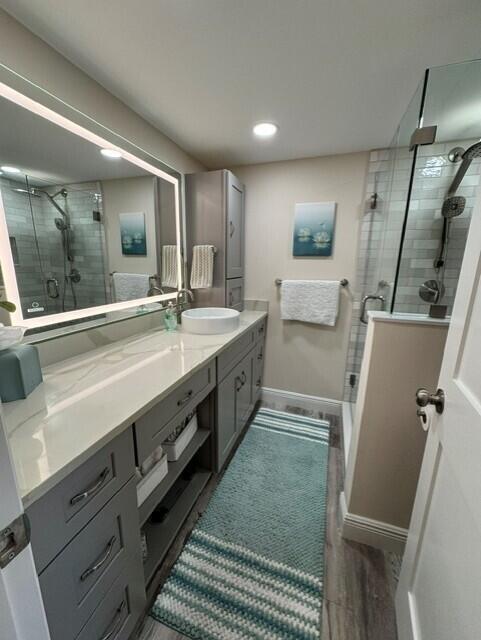 1509 15th Court Jupiter, FL 33477 - Photo 9 of 19 a spacious bathroom with double vanity and a mirror