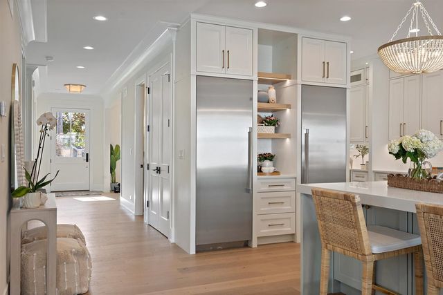 a view of a dining room with furniture and a window