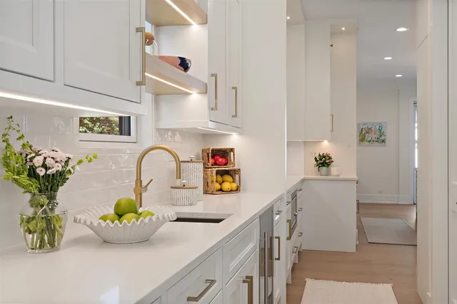 a kitchen with a sink and cabinets